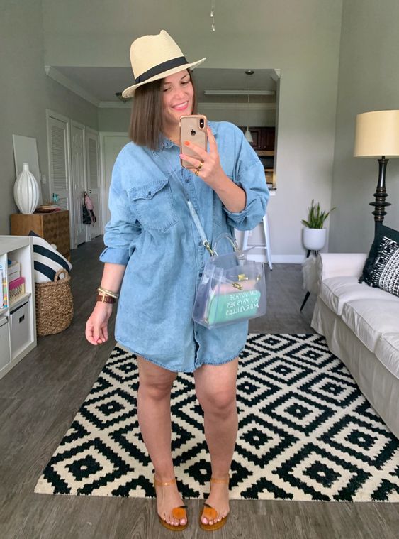 a blue denim shirtdress, quirky bright sandals, a clear bag and a hat for a beach look