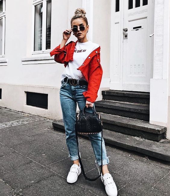 a bright summer look with a white tee, a red cropped denim jacket, blue jeans, white sneakers and a black bag