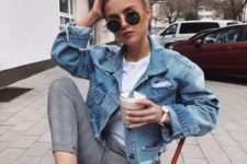 a casual look with a white tee, grey plaid cropped pants, a blue ripped denim jacket and white sneakers