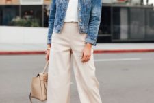 a casual outfit with a white top, tan culottes, a blue cropped denim jacket, nude shoes and a bag
