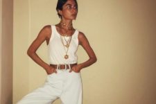 a chic summer look with a white tank top, wideleg high waisted pants, a belt and layered chunky necklaces