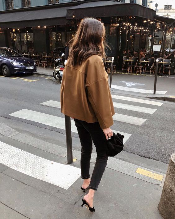 a cognac leather jacket, black skinnies, black heeled mules and a black are a cool idea for spring