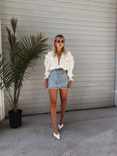 a date look with an embellished oversized blouse, a short blue denim skirt, white pointed toe shoes