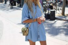 a light blue denim shirtdress with short sleeves, white sneakers and nude socks plus a gold bag