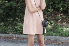 a minimalist pink mini dress with no sleeves, black heeled mules and a crossbody bag for spring and summer