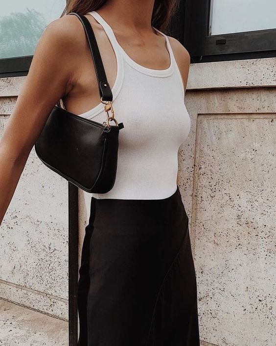 a minimalist summer look with a white tank top, a black skirt, a black baguette bag is amazing