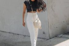 a monochromatic look with a black tie up tee, white high waisted pants, white pointed toe shoes and a round bag