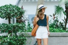 a monochromatic look with a black top, white mini shorts, white sneakers and a hat plus a brown tote