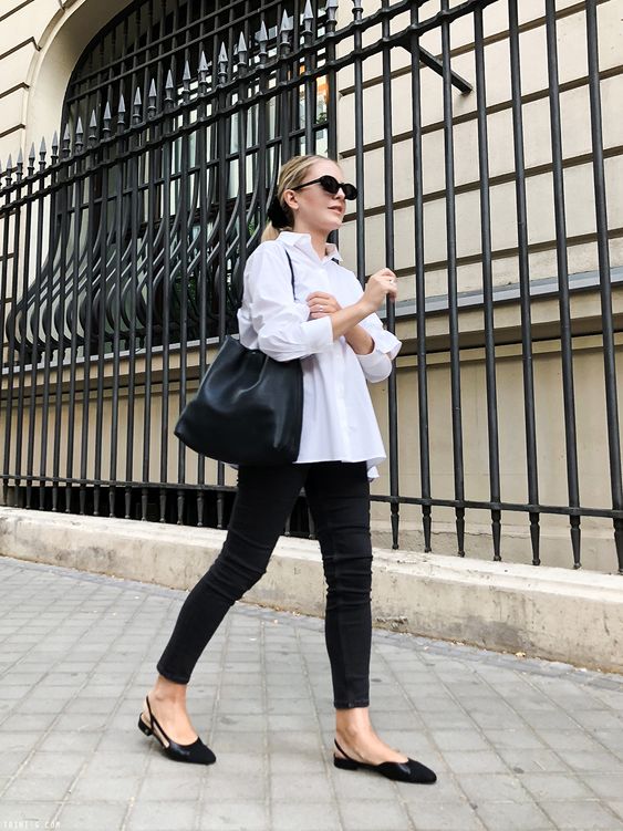a monochromatic look with an oversized white shirt, black skinnies, black slingbacks and a large tote