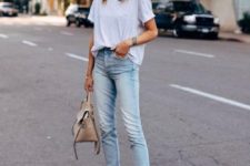 a neutral oversized tee, blue jeans, nude pointed toe heels and a neutral tote for work
