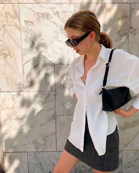 a simple outfit with a grey mini skirt, a white oversized shirt, a black baguette bag is cool for every day