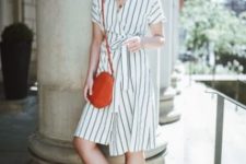 a simple striped summer wrap knee dress, a pink vintage-inspired bag and black heeled mules