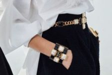 a statement black, white and gold bejeweled bracelet and a matching belt for accenting a monochromatic look