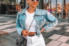 a trendy summer look with a white crop top, a white denim mini skirt, a blue cropped denim jacket and a crossbody