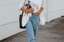 a trendy summer outfit with a white tee, light blue jeans, an oversized white blazer and plaid slingbacks