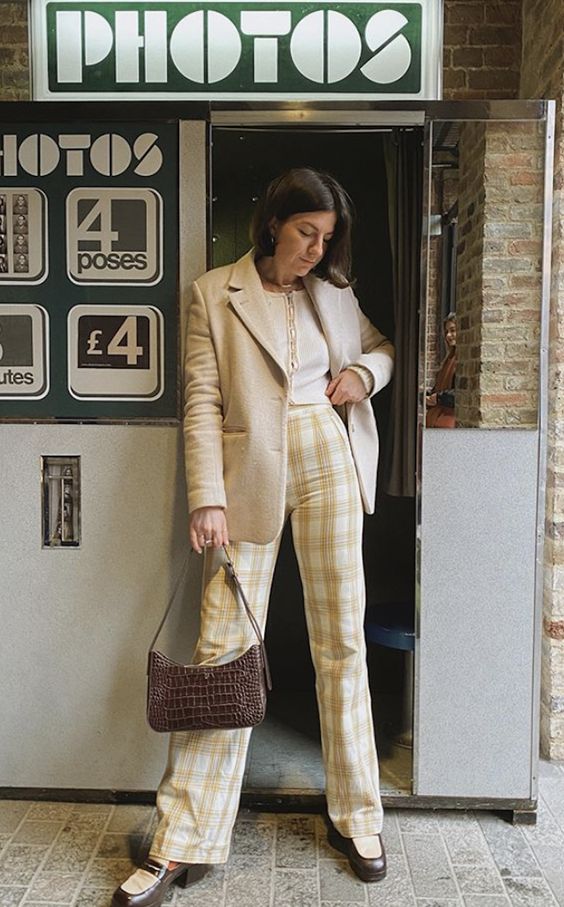 a white crop top, plaid pants, an oversized blazer, vintage-inspried shoes and a baguette bag in brown leather
