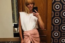 a white padded shoulder t-shirt and a pink draped midi skirt for a summer look