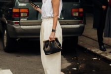 a white padded shoulder t-shirt, neutral oversized pants, animal print shoes, a gold chain