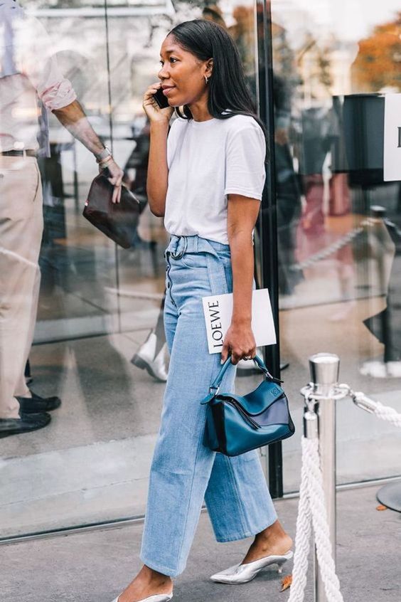 A white t shirt, blue jeans with a sash, silver kitten heel mules and a bold teal bag for spring