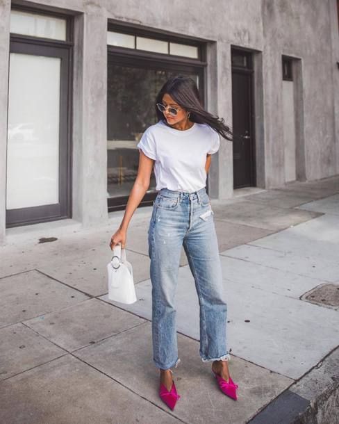 a white tee, blue jeans, fuchsia bow pointed toe shoes and a white bucket bag