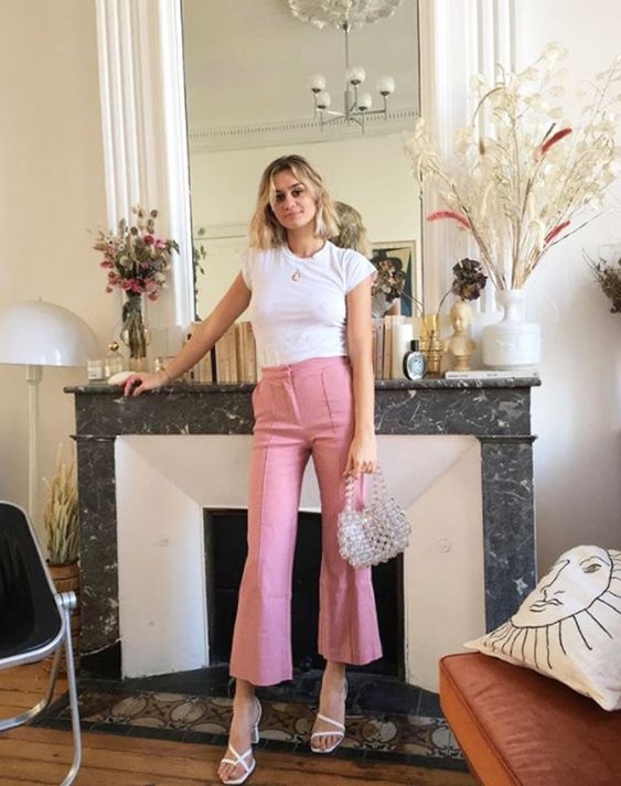 a white tee, pink fit and flare pants, white square toe sandals and a silver bag for a trendy look