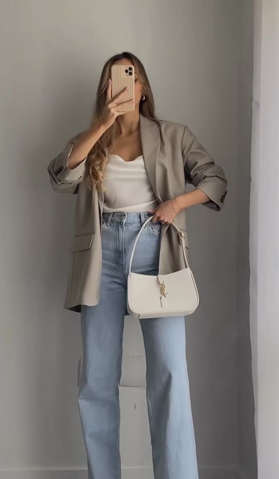 a white top, a grey oversized blazer, bleached jeans, a white baguette bag are a cool look for spring
