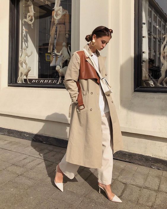 a work look with a white long sleeve top, creamy jeans, white mules, a tan and brown trench for spring