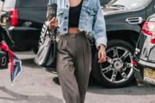 an edgy summer look with a black crop top, a blue denim cropped jacket, grey high waisted pants, black shoes and a bag