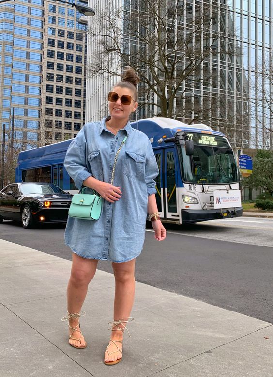 an oversized denim shirtdress, nude lace up shoes and a bright green crossbody
