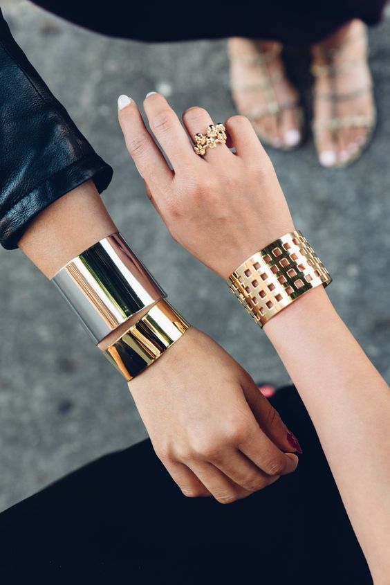 statement bracelets in gold and silver with a bold minimalist design look really edgy