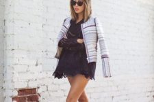 With black lace mini dress, printed jacket and sunglasses
