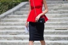With black pencil skirt, black pumps and chain strap bag