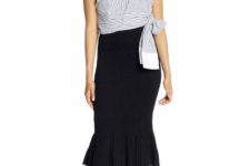With black ruffled midi skirt and black ankle strap high heels