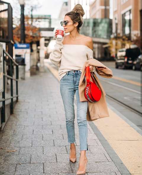 With cropped jeans, red bag and beige pumps