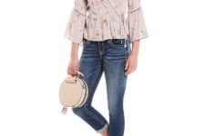 With cuffed jeans, white flat mules and rounded bag