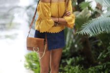 With denim mini skirt, brown bag and gray low heeled shoes