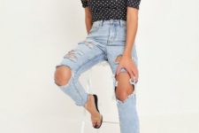 With distressed jeans and transparent shoes
