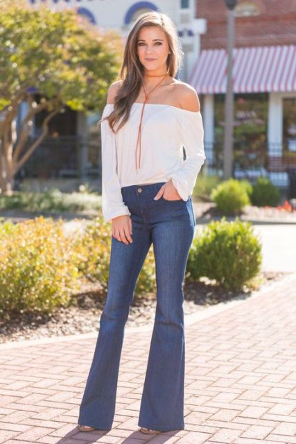 With flare jeans and platform shoes