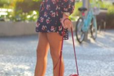 With floral mini dress and red bag