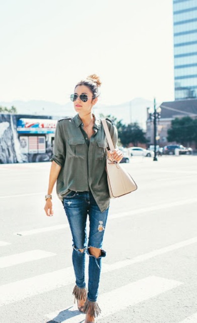 With gray loose shirt, beige bag and super distressed jeans