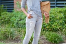 With gray one shoulder shirt, distressed jeans and olive green cutout shoes