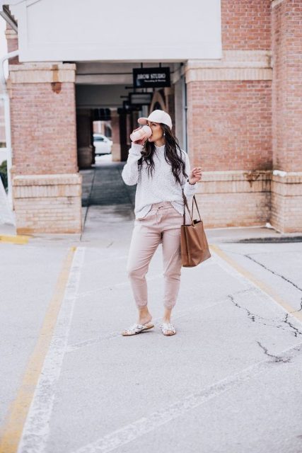 With gray sweatshirt, brown tote bag, cap and flat sandals