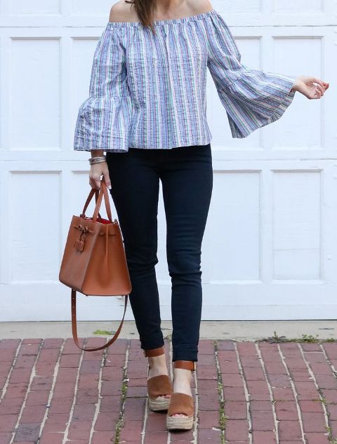 With navy blue jeans, brown bag and platform sandals