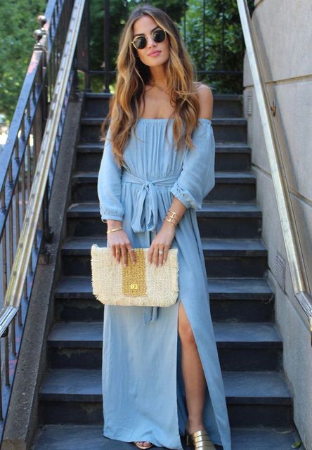 With rounded sunglasses, two colored clutch and golden sandals