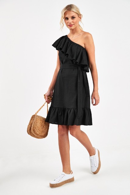 With straw bag and white flat shoes