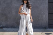 With striped culotte jumpsuit and clutch