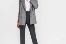 With white V-neck shirt, gray trousers and gray printed blazer