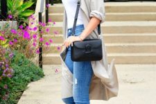 With white shirt, light gray cardigan, distressed jeans and black bag