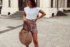 With white t-shirt, leopard ruffle mini skirt and rounded bag