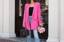 a black top, blue cropped high waisted jeans, black heels, a hot pink blazer and a black bag